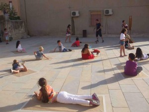 Children join in an activity during Camp Lampedusa, June 2013