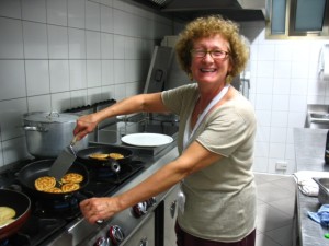 Mariella Bertelli making pancakes for the local children in Lampedusa, Italy. Photo courtesy of Mariella Bertelli.